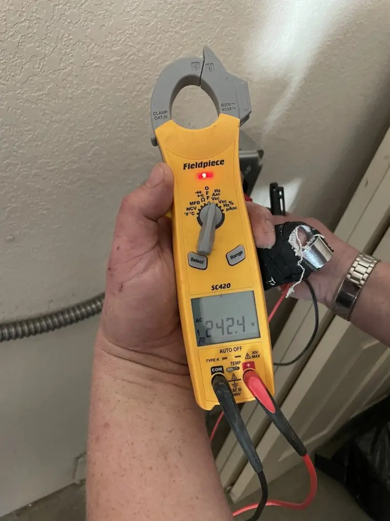 Voltage testing with clamp meter during Ceiling Fan Installation in West Amwell